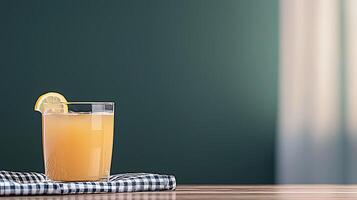 Refreshing citrus drink on a wooden table with a checkered napkin and soft background light photo