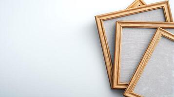 Three empty wooden picture frames arranged artistically on a light background photo