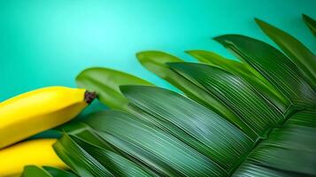 Vibrant arrangement of ripe bananas beside lush green leaves on a teal background, ideal for food themes photo