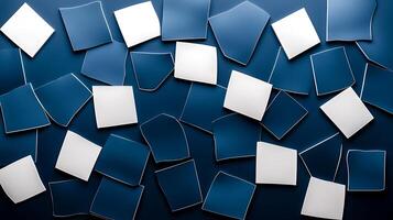 Abstract arrangement of blue and white geometric shapes scattered on a dark background photo