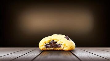 Close-up of a freshly baked chocolate chip cookie with a gooey center on a wooden table photo