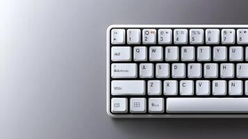 Close-up view of a modern white keyboard on a sleek gray surface, showcasing its design and functionality photo