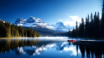 Serene lake surrounded by majestic mountains and lush forests under a clear blue sky photo