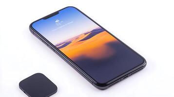 Sleek smartphone displaying a serene desert landscape on its screen, with a minimalist design photo