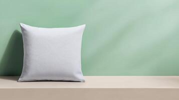 Soft white pillow resting on a minimalist shelf against a pastel green wall, creating a serene ambiance photo
