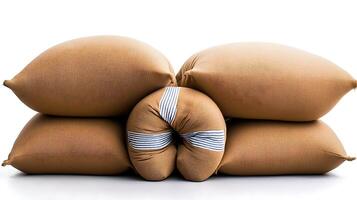 Stacked cushions in warm tones, showcasing texture and design against a white background photo