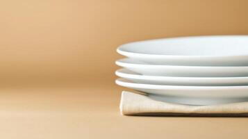 Stacked white plates on a beige background, showcasing minimalistic dining setup for culinary use photo