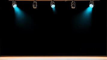 Stage lights illuminating an empty performance space with a dark background, ready for a show photo