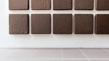 Textured brown tiles arranged in a grid pattern on a clean wall, showcasing modern design elements photo