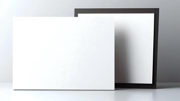 Two blank picture frames leaning against a subtle gray background, emphasizing minimalism photo