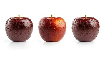 Three glossy red apples with water droplets, arranged on a clean white background, ideal for food photography photo