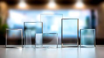 Various glass frames arranged on a table, reflecting light, with a blurred modern background photo