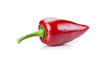 Vibrant red chili pepper resting on a reflective surface with a clean white background photo