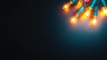 Vibrant string of colorful light bulbs glowing against a dark background, creating a festive atmosphere photo