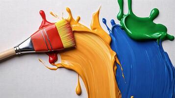 Vibrant paint colors with a brush creating a splash on a textured canvas background photo