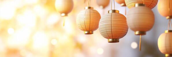 Softly glowing lanterns hang against a warm, blurred background. photo