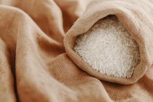 A bag of rice on a brown cloth photo