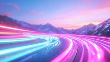 Vibrant light trails winding through a mountainous landscape at sunset. photo
