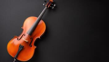 A close-up of a violin resting on a dark surface. photo