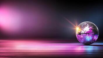 A sparkling disco ball reflecting colorful lights on a wooden floor. photo