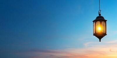 A lantern glowing against a twilight sky, creating a serene atmosphere. photo