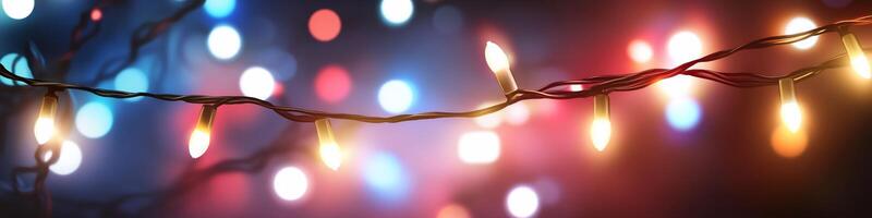 A colorful display of festive lights glowing in a dark background. photo