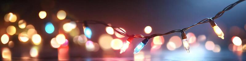 Colorful string lights against a blurred background create a festive ambiance. photo