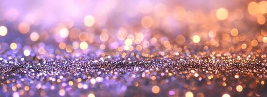 A shimmering abstract background with bokeh effect in purple and gold. photo