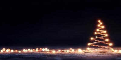 A glowing wire Christmas tree with lights on a dark background. photo