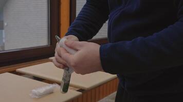 man unpacking new paint roller. close up of paint roller change process video