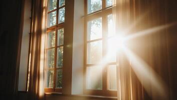Sunlight streams through windows, illuminating a serene indoor space. photo
