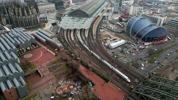 Cologne, Germany. Cologne railway station. In the city center is a large station with many platforms and tracks. Aerial view of the railway station with trains video