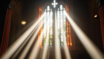 Sunlight streams through a gothic window, illuminating a serene interior. photo