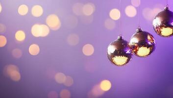 Three shiny disco balls hanging from a string photo