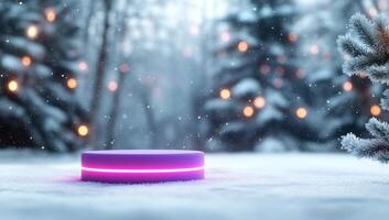 A glowing device in a snowy landscape with festive lights. photo