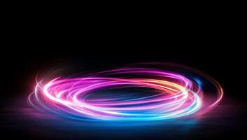 Abstract swirl of colorful light against a dark background. photo