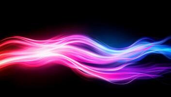 A vibrant abstract wave of colorful light on a black background. photo