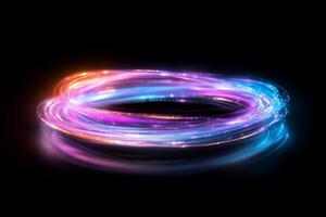 A vibrant swirl of colorful light trails on a dark background. photo