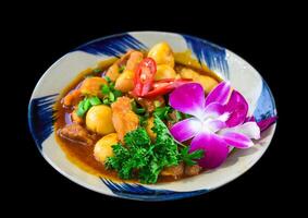 Vietnamese braised pork with boiled eggs in sauce for a menu side view photo