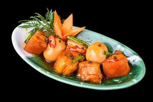 Vietnamese braised pork with boiled eggs in soy sauce for a menu side view photo