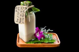 Vietnamese yogurt with flowers and sign with vietnamese text in translation Have a nice day photo