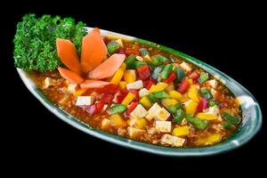 Vietnamese tofu with with minced meat sauce on black background photo