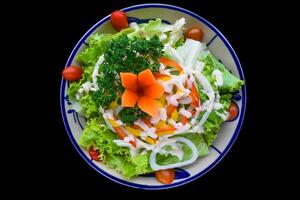Vietnamese salad with vegetables on black background top view photo
