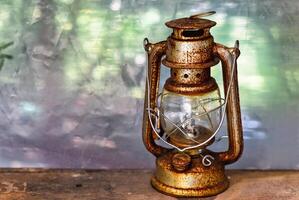 vintage rusty lamp on the table with copy space photo