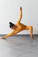 Side Lunge pose variation or Skandasana with woman making photo