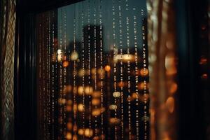 A window with lights and a city skyline in the background photo