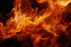 Fiery flames against a dark background. Detailed close-up view of intense orange and red flames, with smoke and heat photo