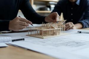 Architects reviewing architectural model photo