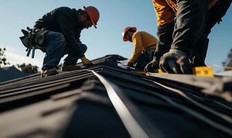 Roofing crew installing new tiles. Skilled workers meticulously place roofing materials photo