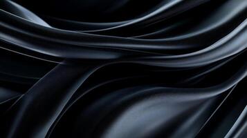 Dark, flowing fabric with elegant, smooth curves and deep shadows photo